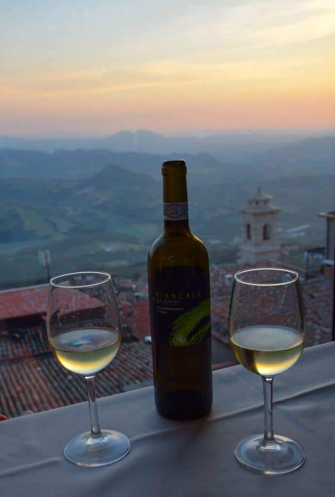 Two glasses of white wine in Italy overlooking the sunset